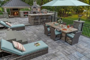 Outdoor patio, bar and grill made of stone pavers.